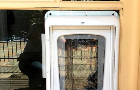 external view modified timber bar door to suit pet door installation min